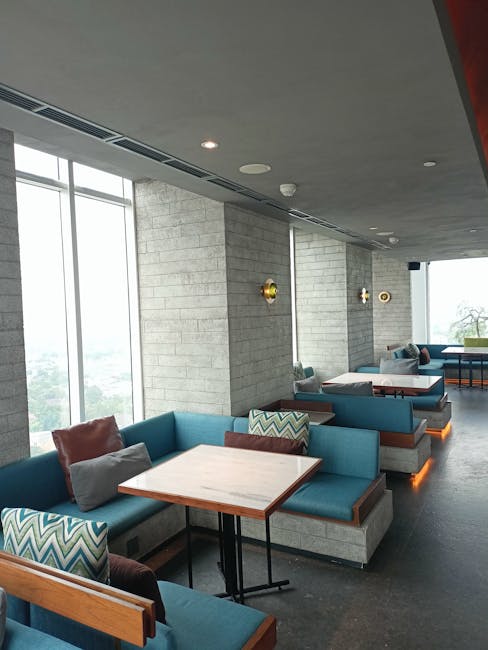 Elegant lounge with red ambient lighting and luxurious decor